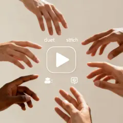 Hands reach for a play button, symbolizing collaboration and the creation of a social media viral video through duet and stitch features.