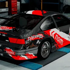 Wyścigowy samochód w garażu, gotowy do akcji w BeamNG Drive za darmo. Czerwono-białe malowanie z numerem 71.