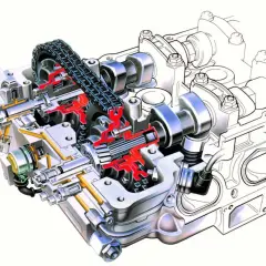 Przekrój silnika z widocznymi wałkami rozrządu, łańcuchem i mechanizmem zmienne fazy rozrządu.
