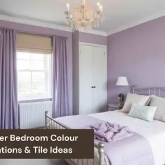 A serene bedroom featuring various lavender color shades on the walls, curtains, and bedding. A crystal chandelier hangs above.