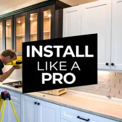 A man uses a laser level to ensure cabinets are perfectly aligned, demonstrating how to hang cabinets like a pro.