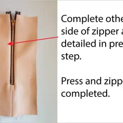 Sewing a garment, showing an exposed zipper on light-colored fabric. Instructions indicate to complete the other side of the zipper.