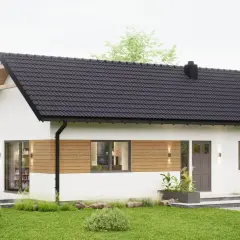 Nowoczesny dom modułowy 70m2 pod klucz cena. Biała bryła z drewnianymi akcentami, czarny dach, taras z meblami.