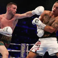 Boxer lands a punch, showcasing the intensity of a middleweight weight limit bout.