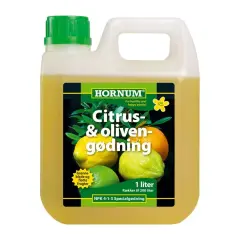 En flaska med citrusnäring från Hornum, med bilder på citroner och apelsiner. Ger friska blad och fina frukter.