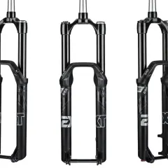Three black EXT era bicycle forks are displayed.