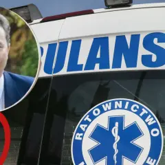 Mężczyzna w garniturze obok karetki. Czyżby to był przełom nadciśnieniowy w jego karierze?
