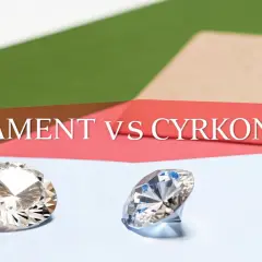 Dwa błyszczące kamienie, jeden diament, drugi cyrkonia, porównane pod kątem ich znaczenia i wyglądu.
