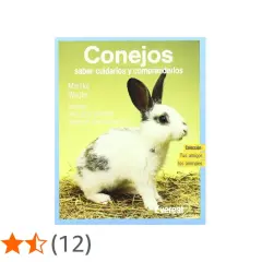 Un conejo blanco y negro en un libro sobre qué comen los conejos y cómo cuidarlos.