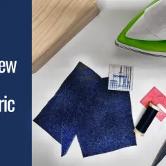 Gather supplies to learn how to sew wool fabric: dark blue wool scraps, thread, needles, scissors, an iron, and a wooden block.