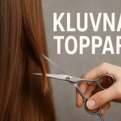 En hand klipper bort kluvna toppar från långt, brunt hår med en sax.
