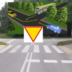 Skrzyżowanie równorzędne z żółtym trójkątem ustąp pierwszeństwa. Żółty samochód skręca, niebieski jedzie prosto, a autobus skręca w lewo.