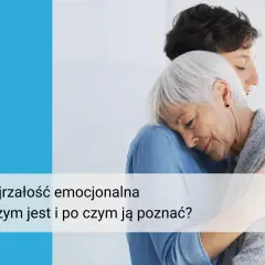 Dwie kobiety w uścisku, symbolizujące dojrzałość emocjonalną i wsparcie.