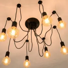 Nowoczesna lampa sufitowa z wieloma żarówkami. Dowiedz się, jak przesunąć lampę sufitową bez kucia, wykorzystując jej elastyczną konstrukcję.