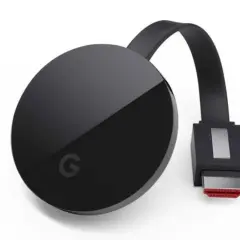 Czarny Chromecast z logo Google. Dowiedz się, jak połączyć się z chromecast, aby strumieniować treści.