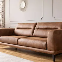A stylish brown leather sofa, perfect for any living room. Learn how to clean leather furniture to keep it looking its best.