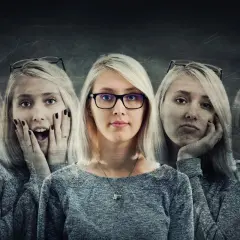 Kobieta w okularach, otoczona swoimi różnymi emocjami. Czy osobowość schizoidalna a małżeństwo to trudne połączenie?