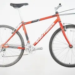 A vintage red Gary Fisher Piranha mountain bike, ready for adventure.