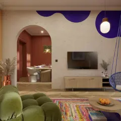 Nowoczesny salon z huśtawką, kolorowym dywanem i widokiem na jadalnię.