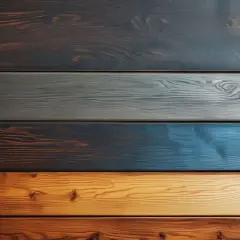 Cinq planches de bois aux teintes variées, du brun foncé au bleu vif, offrant une belle idée déco bois pour un intérieur moderne.