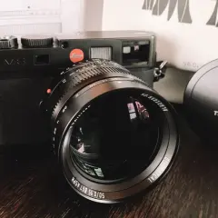 Leica M8 camera with a TTArtisan 50mm f/0.95 lens. The lens has "50/0.95" clearly visible.