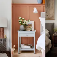 Three stylish nightstand ideas: a marble table with a copper lamp, a pale blue table with flowers, and a dark wood dresser with a green lamp.