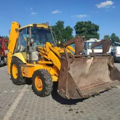 Żółta koparko-ładowarka JCB 3CX, gotowa do pracy. Sprawdź jej jcb 3cx dane techniczne!