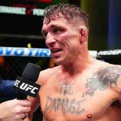 A bloodied fighter, interviewed post-fight, shows the "md" in boxing is the damage taken. His chest tattoo reads "THE DAMAGE".