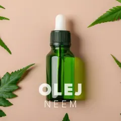 Olej neem na twarz jak stosować? Zobacz, jak naturalne składniki mogą odmienić Twoją skórę. Butelka z pipetą i liście drzewa neem.