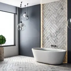 Nowoczesna łazienka z wolnostojącą wanną i designerskim oświetleniem.