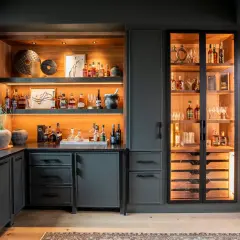 Stylish basement bar ideas featuring illuminated shelves stocked with liquor bottles, glassware, and decorative items.