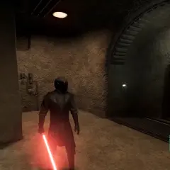 Postać w czarnym stroju z czerwonym mieczem świetlnym, w mrocznym korytarzu, przypomina początki **star wars genesis**.