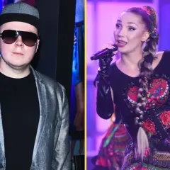 Donatan i Cleo na scenie. Donatan w szarej marynarce i czapce, Cleo w tradycyjnej sukni z haftem.
