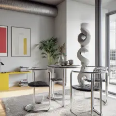 Nowoczesne wnętrze w stylu bauhaus: okrągły stolik z krzesłami, abstrakcyjne obrazy, żółta konsola i rzeźba.