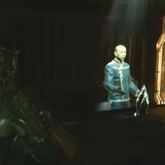 Isaac w zbroi patrzy na hologram doktora w Dead Space Remake. Poradnik pomoże Ci przetrwać.