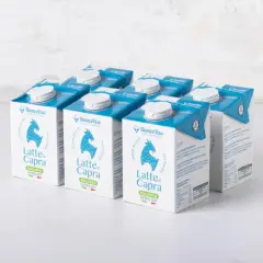 Scatole di latte di capra biologico, con un disegno di capra e la scritta "Latte di Capra".