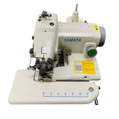 A Yamata sewing machine with a blind stitch foot attachment, ready to demonstrate how to use a blind stitch foot for invisible hems.