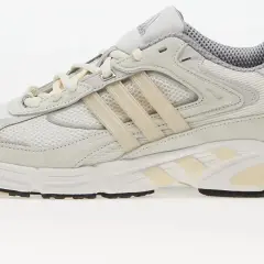 Białe buty sportowe adidas Response CL z beżowymi akcentami, idealne na codzienne treningi i spacery.