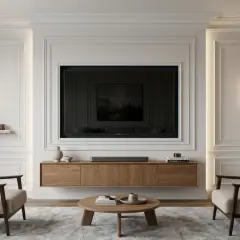 Elegancka sztukateria za telewizorem tworzy wyrafinowaną ramę dla nowoczesnego salonu.