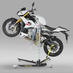 Biały motocykl BMW uniesiony na podnośniku motocyklowym centralnym.