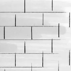Schemi posa a correre sfalsata: linee nere su sfondo bianco che simulano mattoni disposti in modo irregolare, creando un effetto visivo dinamico.