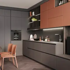 Cuisine moderne avec des armoires grises et des accents rouille. La couleur mur cuisine est subtile, contrastant avec les éléments plus foncés.