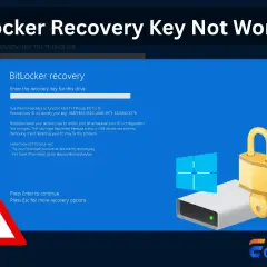 Ekran odzyskiwania BitLocker, gdy klucz nie działa. Widoczny dysk z kłódką i kluczem, symbol Windows oraz ostrzeżenie.