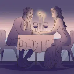 Romantyczna kolacja we dwoje. Para świętuje 1 rocznicę ślubu przy świecach i winie.