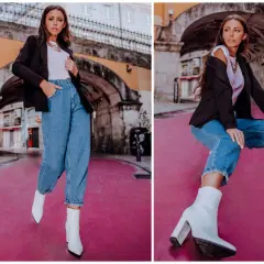 Kobieta w jeansach mom fit i białych kozaczkach na obcasie. Stylizacja idealna dla każdej kobiety ceniącej wygodę i modny wygląd.