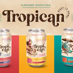 Trzy puszki z napojem "Tropican" o smaku limonki, pomarańczy i marakui. Idealne na lato!
