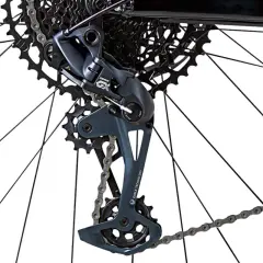 Close-up of a bicycle's rear derailleur with a bent derailleur hanger, showing the cassette and chain.