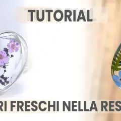 Ciondoli a forma di cuore e goccia con fiori freschi nella resina, perfetti per un tutorial creativo.