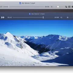 Two iina windows display a snowy mountain landscape. The front window shows a movie player with a ski resort scene.