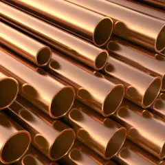 Stosowanie brązu w instalacjach wodnych i grzewczych. Metaliczne rury miedziane ułożone równolegle, tworzące teksturę.